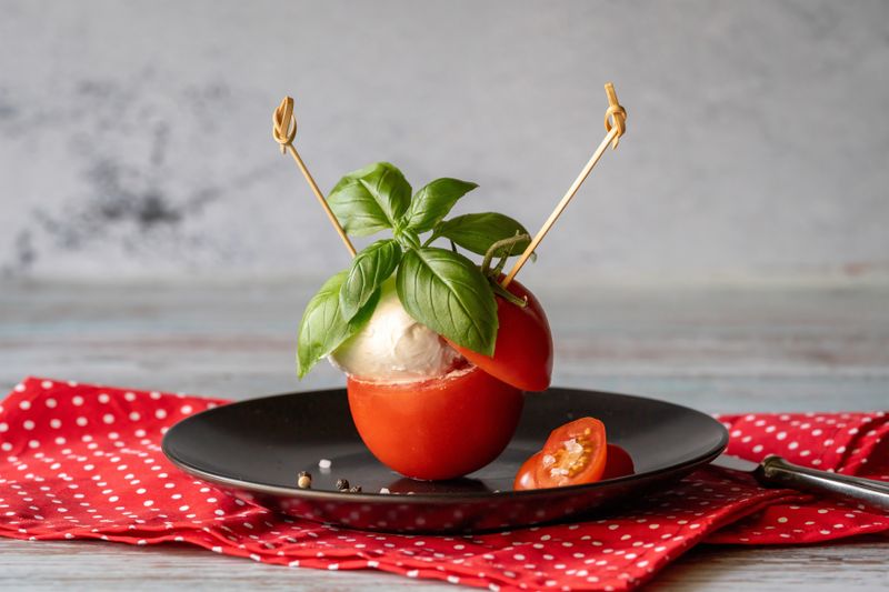 Caprese Salad with fresh buffalo mozzarella and heirloom tomatoes
