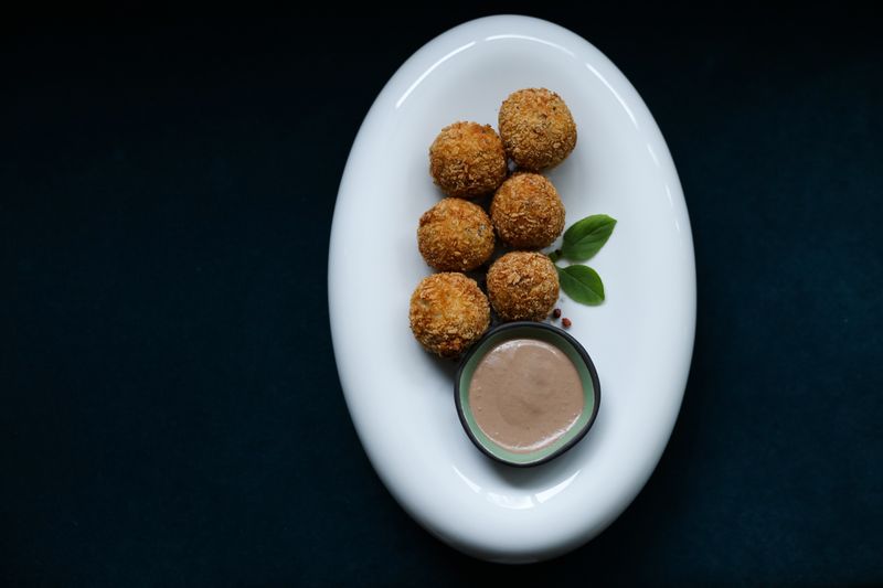 Arancini rice balls with tomato dipping sauce